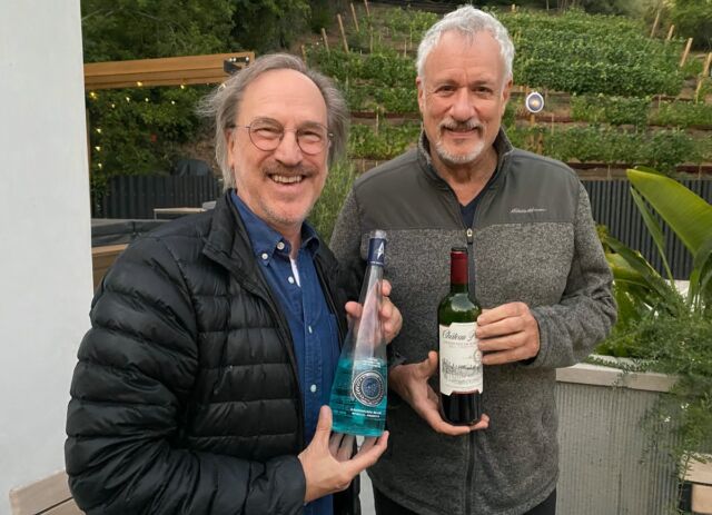 Andre Bormanis—writer on <em>The Orville</em> and past science adviser for <em>TNG</em>—and John de Lancie (<em>TNG, Picard</em>) De Lancie is holding the night's clear winner: a Bordeaux blend from the (very real) Chateau Picard. 
