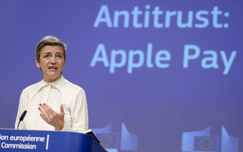 European Commission Executive Vice President Margrethe Vestager speaking at a press conference. The backdrop behind her says 