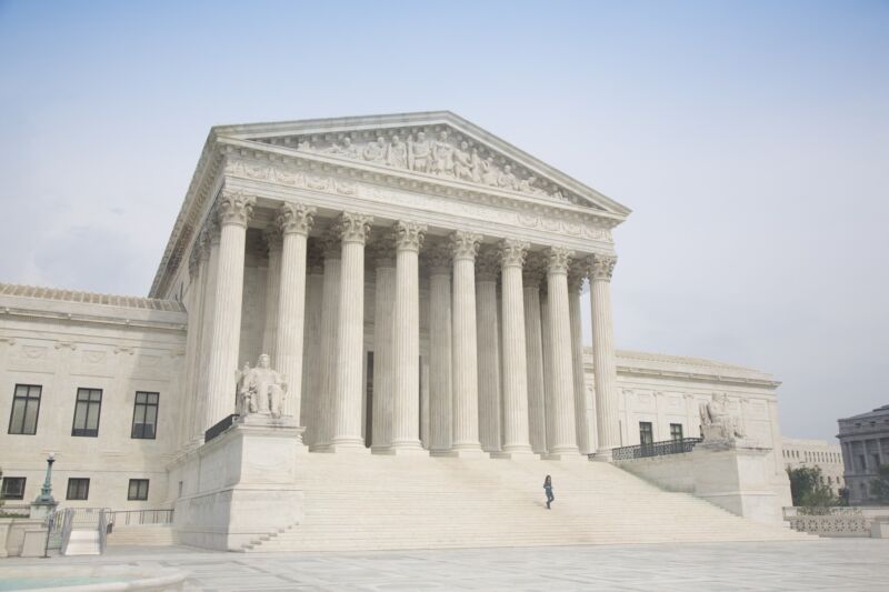 The US Supreme Court Building seen during daytime.