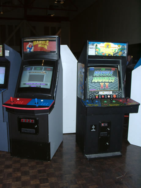 Two <em>Marble Madness II</em> prototypes in the hands of a single collector. Note the joystick-and-button controls for the cabinet on the right.