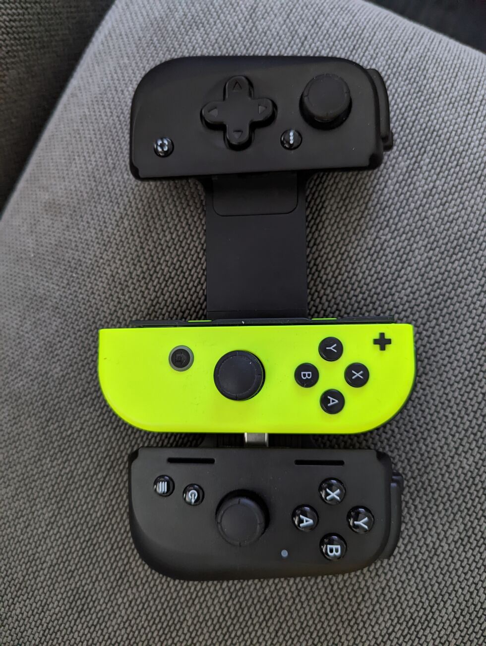 A picture to illustrate my point about the distance between the ABXY array and the joystick;  Kishi V2 in comparison to the Switch Joy-Con.