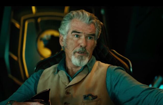 Pierce Brosnan plays Doctor Fate, who learned sorcery and is in possession of the magical Helmet of Fate.