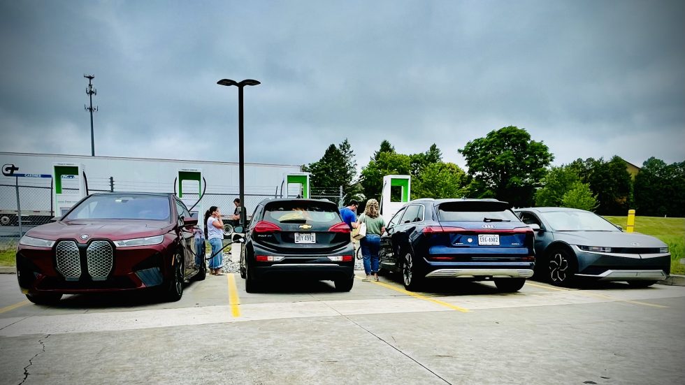 Four cars, four chargers, but only one of us is actually drawing power and recharging their battery because three of the machines were faulty or completely down.