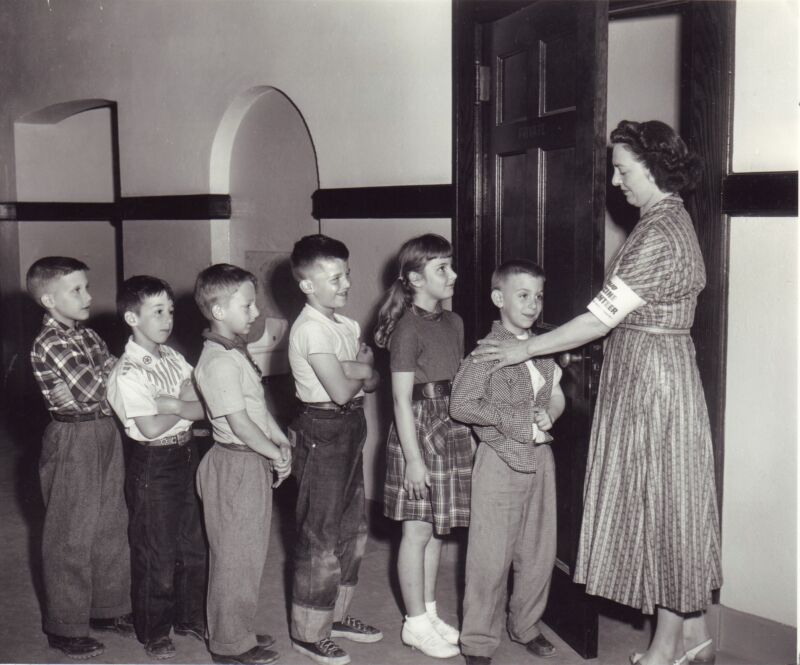 Kids line up to get their polio vaccines at the Woodbury Avenue School in Huntington, New York, on April 27, 1954.