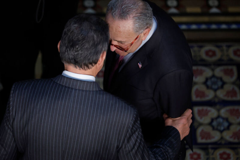 Joe Manchin and Chuck Schumer, who negotiated the new deal, talk earlier in the year.