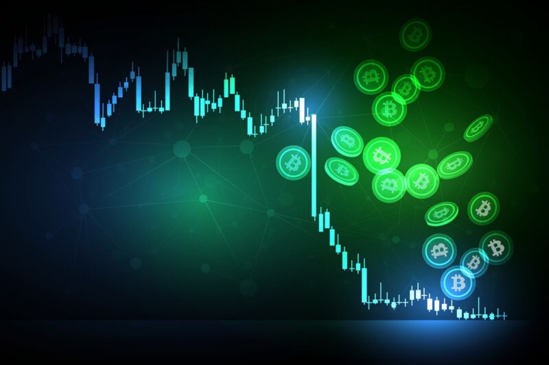 Illustration of cryptocurrency coins falling down and a graph showing a decreasing value.