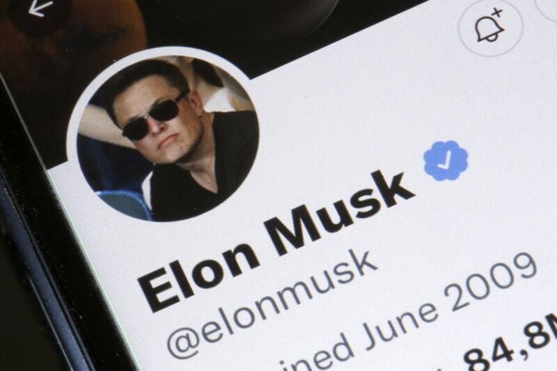 Photo illustration with Elon Musk’s Twitter account displayed on the screen of an iPhone.