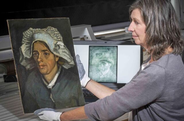Senior Conservator Lesley Stevenson views <em>Head of a Peasant Woman</em> alongside an X-ray image of the hidden Van Gogh self-portrait.