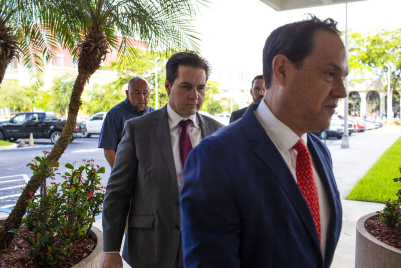 Craig Wright, self-proclaimed bitcoin inventor, center, arrives in federal court with his attorney Andres Rivero, right, in West Palm Beach, Fla., on Friday, June 28, 2019.