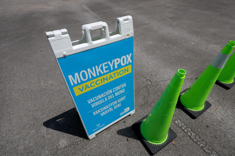 A sign announcing monkeypox vaccination is set up in Tropical Park by Miami-Dade County and Nomi Health on August 15, 2022, in Miami.