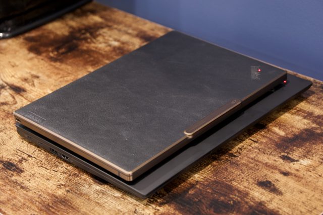 The Lenovo ThinkPad Z13 Gen 1 sitting on top of the ThinkPad X1 Carbon Gen 10, illustrating how the Z13 is less wide and deep.