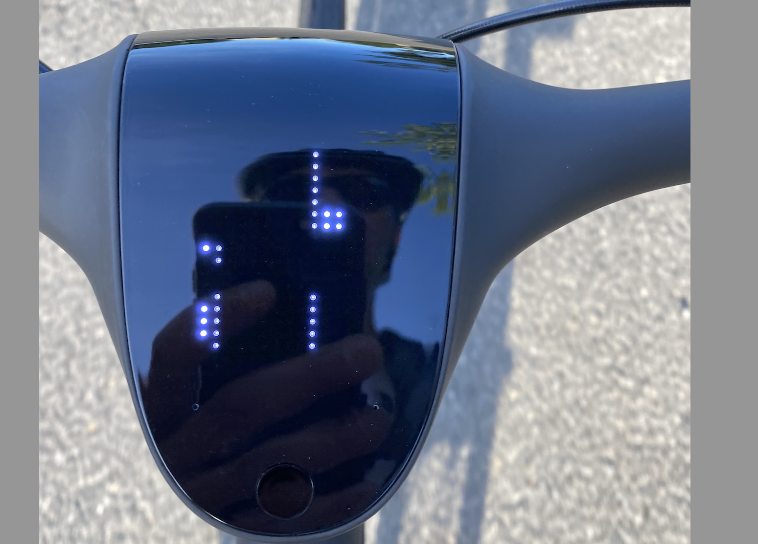 Image of an oval shaped screen with small bright dots.