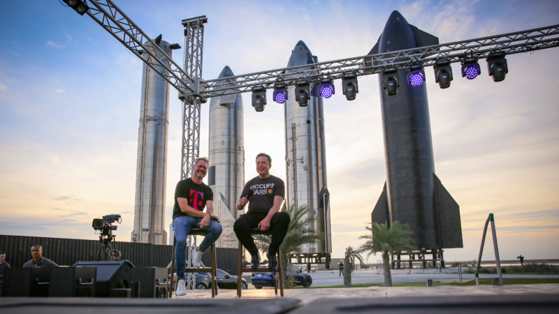 T-Mobile's Mike Sievert and SpaceX's Elon Musk appear on stage at Starbase Thursday evening.