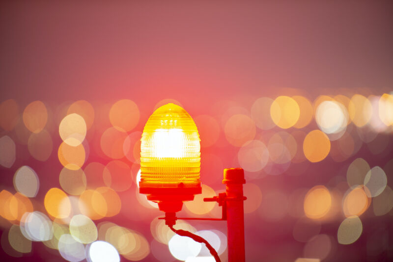 Obstacle light with city bokeh background
