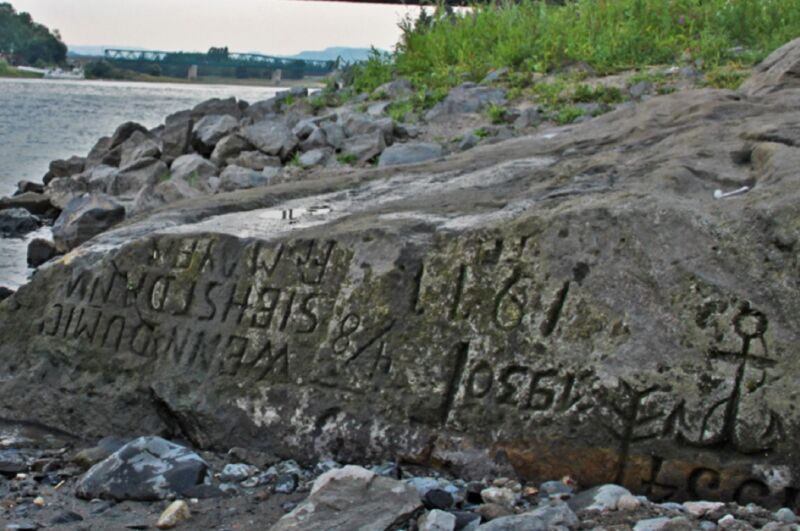 A hunger stone in the Elbe River in Děčín, Czech Republic. The oldest readable carving is from 1616, with older carvings (1417 and 1473) having been wiped out by anchoring ships over the years.