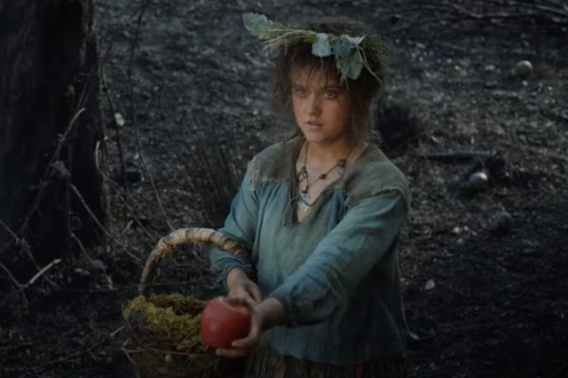 A kind-hearted Harfoot hobbit offers an apple to a mysterious stranger.