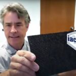 Dorgan displays a sample of a lightweight carbon fiber material made from his recycled resin.