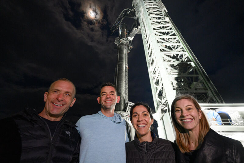 The crew of Polaris Dawn, from left, Scott Poteet, Jared Isaacman, Sarah Gillis, and Anna Menon pose in front of SpaceX's Super Heavy rocket in South Texas.