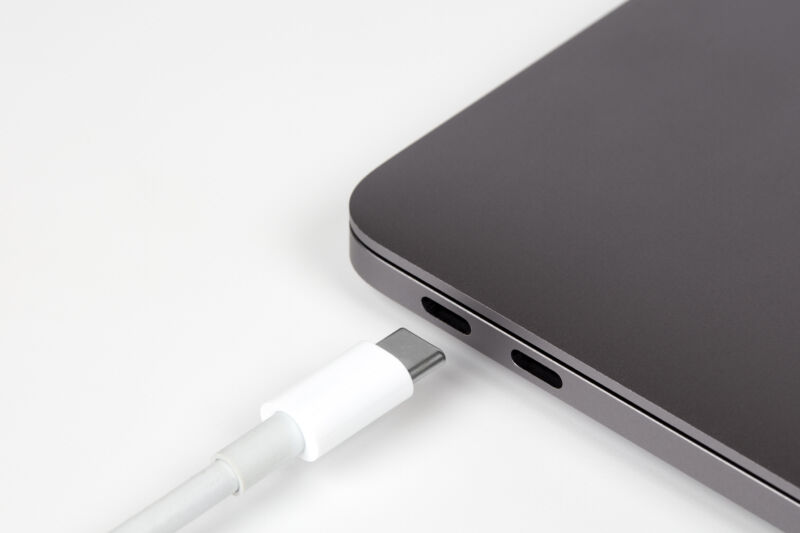A USB-c cable type connects to a laptop computer