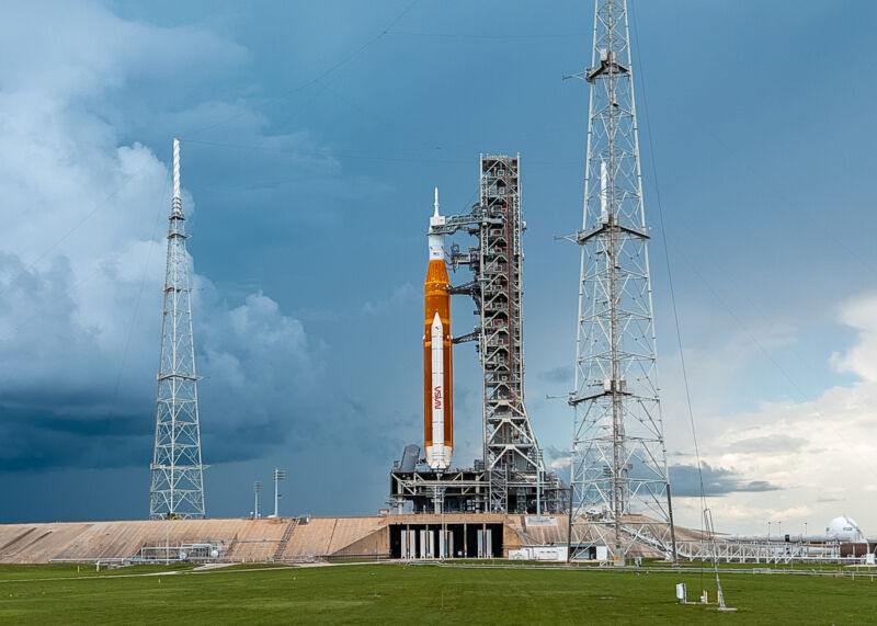 Storm clouds threaten the Space Launch System rocket earlier this year.