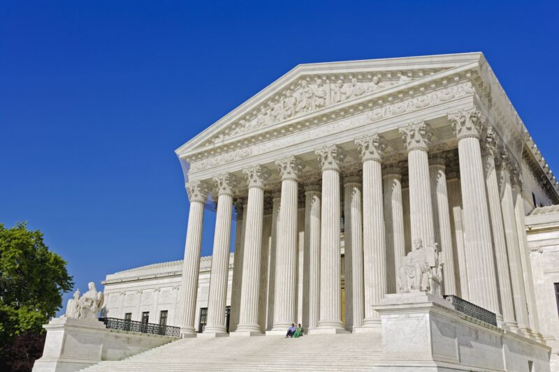 The exterior of the US Supreme Court building during daytime.