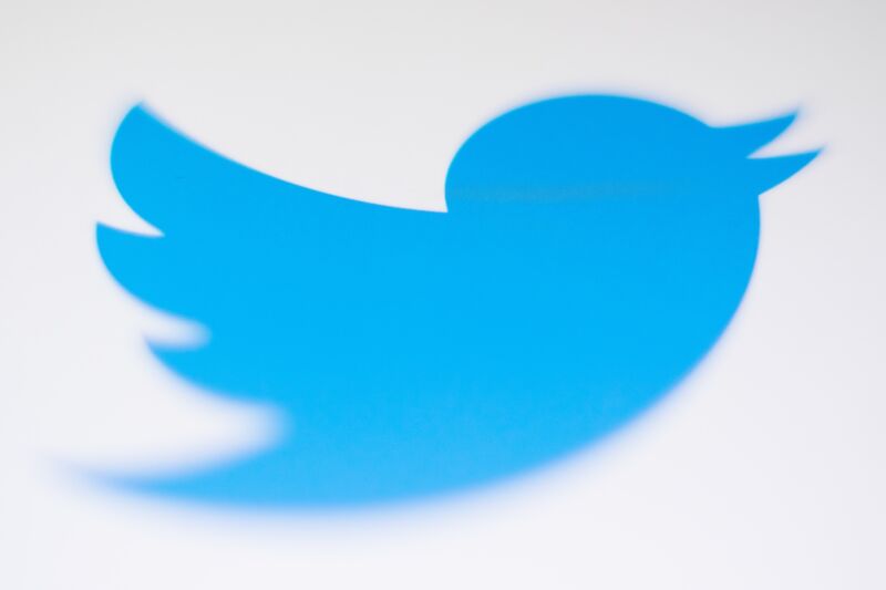 Close-up of a Twitter logo displayed on a smartphone screen.