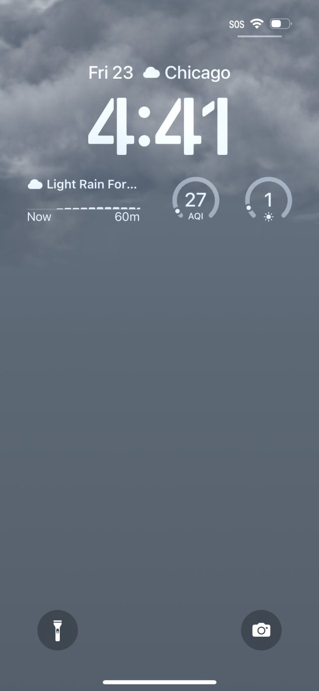 A wallpaper themed on the current weather conditions—in this case, partly cloudy and dark