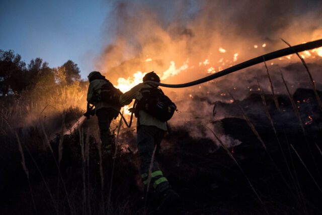 Spaniards fought wildfires in Spain in July 2022 that spread through dry fields and forests.
