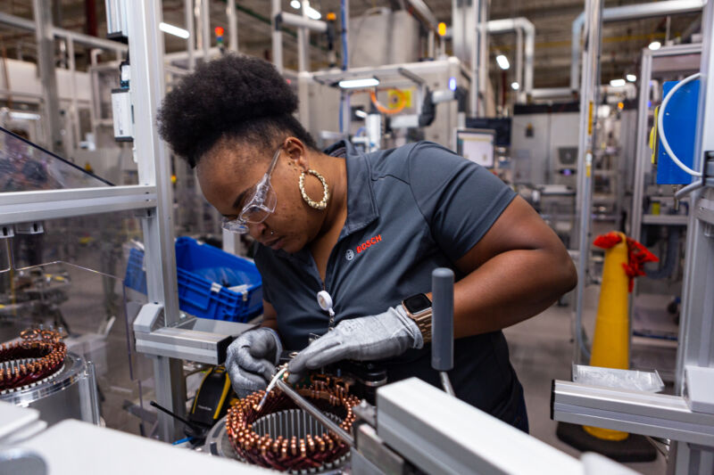 A Bosch worker assembles an electric motor at the company's factory in Charleston, South Carolina.