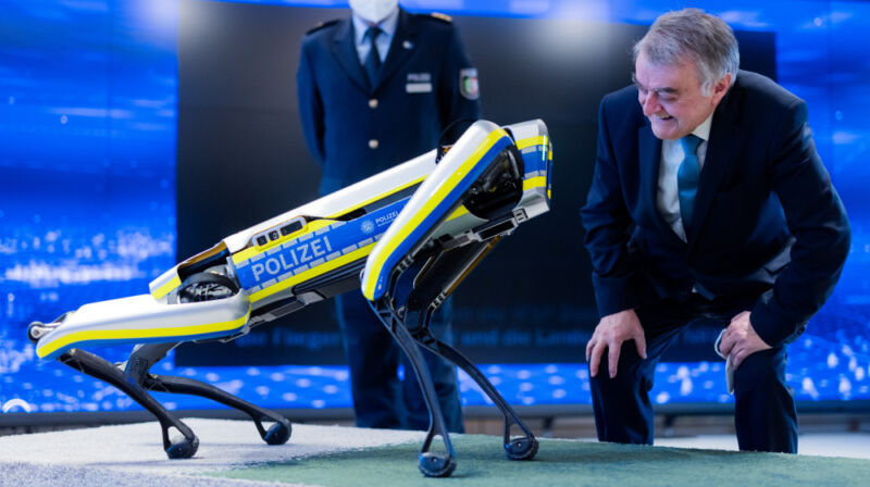 Herbert Reul, Interior Minister of North Rhine-Westphalia, looks at Boston Dynamics' robot dog Spot in January 2022.