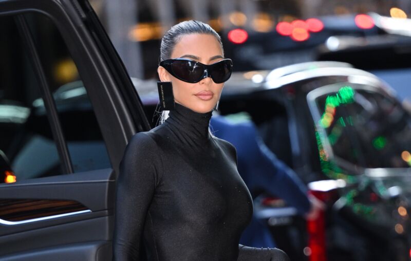 Kim Kardashian seen outside, wearing sunglasses.