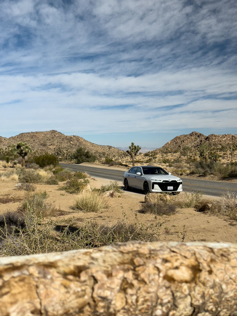 A white BMW 760i in Joshua Tree