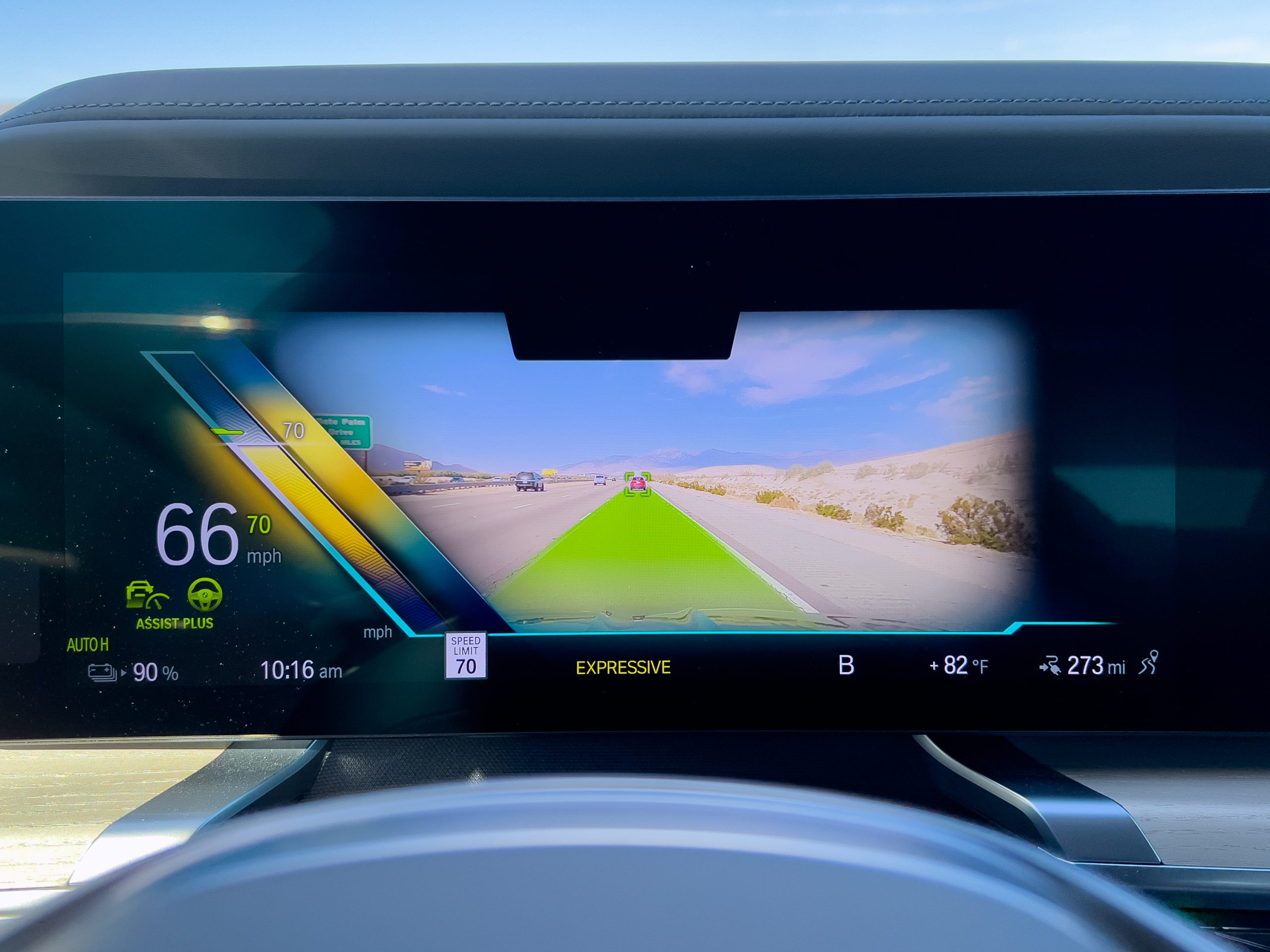 The BMW i7 main display in augmented reality mode, showing Highway Assistant is running