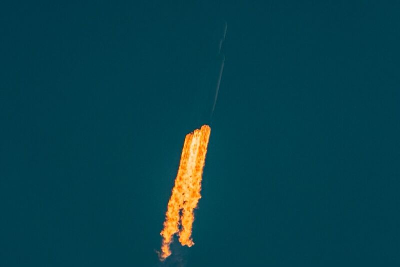The Falcon Heavy rocket as seen at an altitude of about 160 meters on Tuesday, climbing above the fog but disappearing into haze. 
