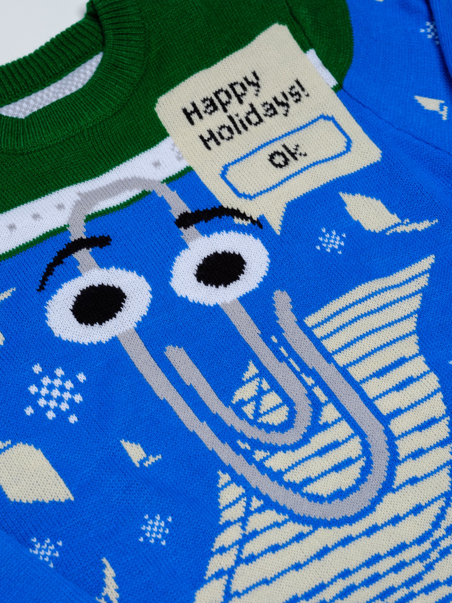 This Year s Ugly Microsoft Sweater Has A Suggestion For You It s 