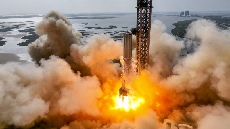 The Booster 7 of SpaceX undergoes a static fire test with 11 engines Tuesday in South Texas.