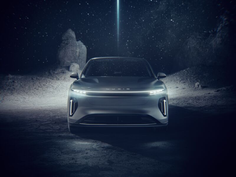 A dramatically lit photo of the Lucid Gravity SUV, seen head-on