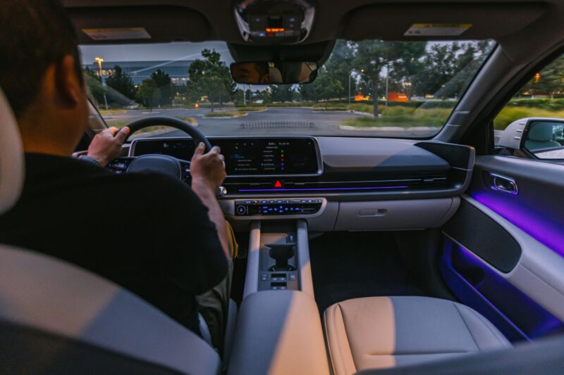 the Hyundai Ioniq 6 interior with a man in the driver's seat