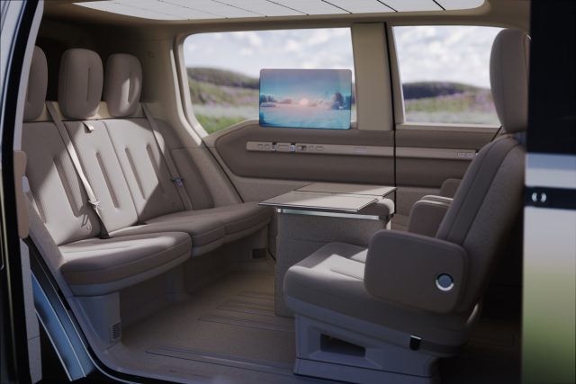 Check out this wild train interior on the Chinese version. It has a centrally-located table and rear-facing front seats. Truely a "living room" layout.