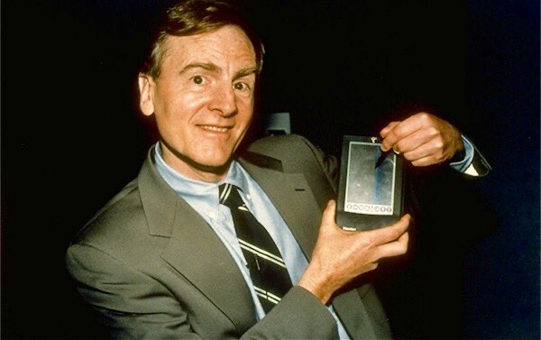 Apple CEO John Sculley demonstrates a pre-production version of the Newton.