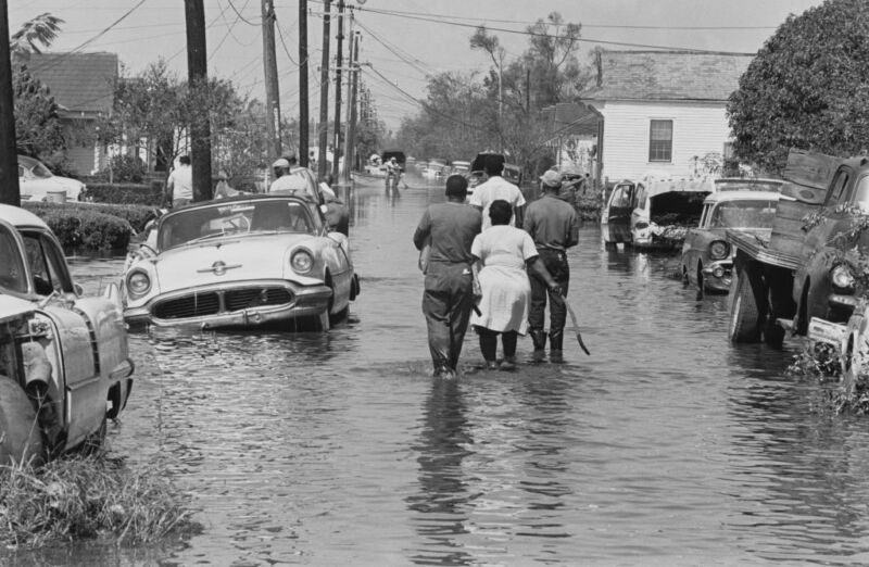 Hundreds of persons returning to their flood-wrecked homes in New Orleans after 1965's Hurricane Betsy.