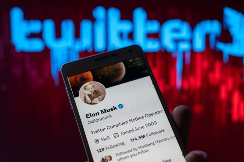 Elon Musk's Twitter account displayed on a smartphone screen in a photo illustration.