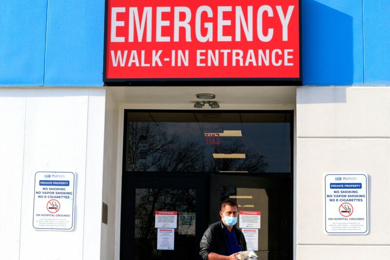 A health care worker exits the emergency room at Hudson Regional Hospital in Secaucus, New Jersey, on December 11, 2020.