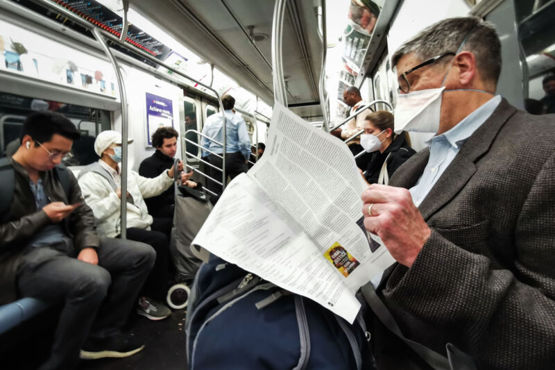 Commuters in a subway in New York on October 25, 2022. 