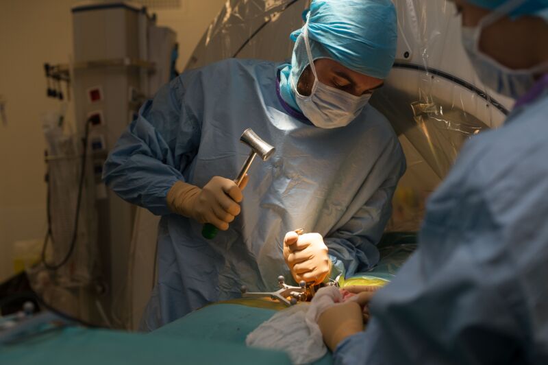 Surgeons performing a spinal surgical operation in Good, France.