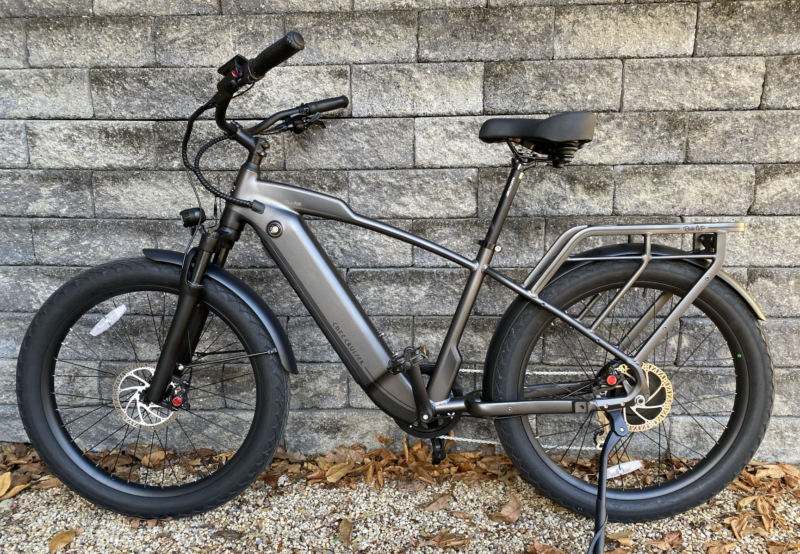 Image of an e-bike leaning against a wall.