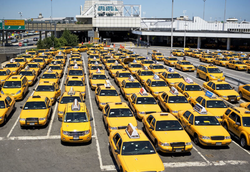 Rows of taxis waiting at airport