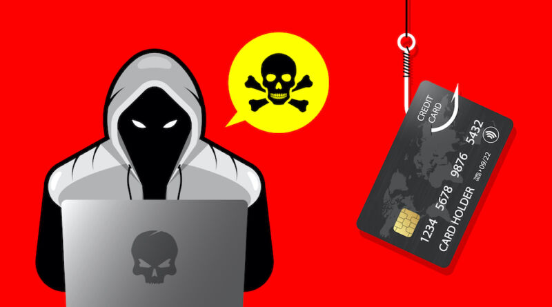Persona con capucha negra con laptop intentando un ataque cibernético.