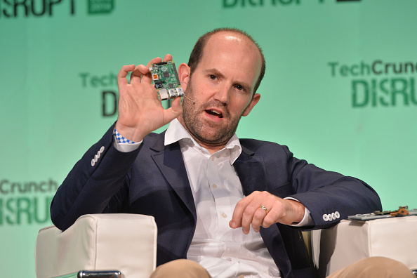 Raspberry PI CEO Eben Upton holding a Raspberry Pi on-stage at TechCrunch Disrupt 2014.