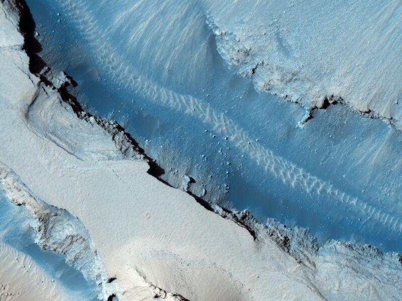 Image of a steep-sided valley from above.